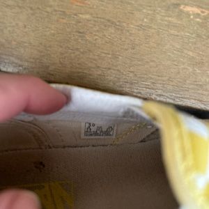 Kids, yellow and white slip on vans